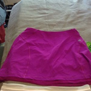 2 tennis skirts and a workout top