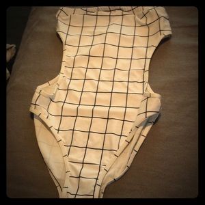 New. Strapless. Open at the sides.