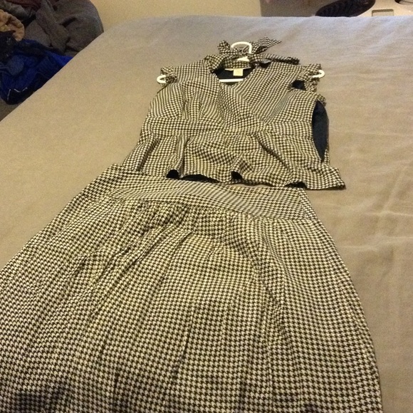 Another chic suit with pleated skirt