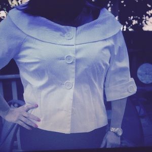 White blazer with buttons and round collar