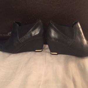 Black leather wedge booties