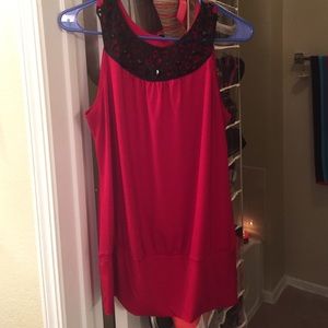 Red blouse with swirl design