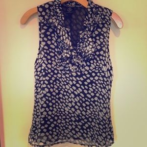 Black and white sleeveless blouse