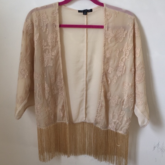 very cute beige color cardigan.