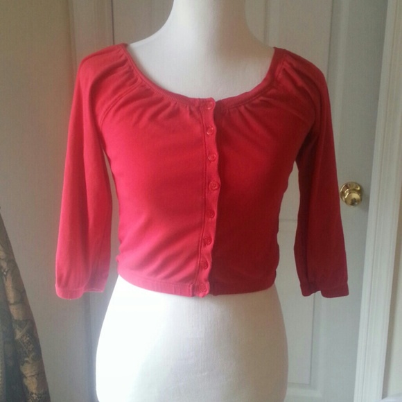 Red short button up cardigan.