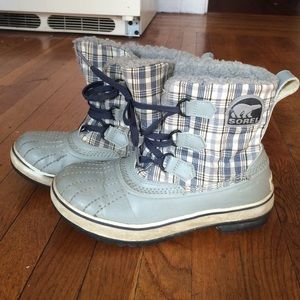 Sorel size six waterproof blue plaid snow boots.