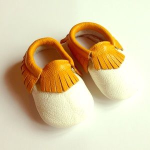 NWOT Genuine leather cream and cognac fringe.