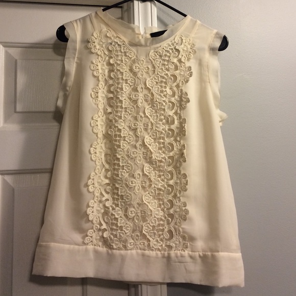 Cream colored dress shirt.