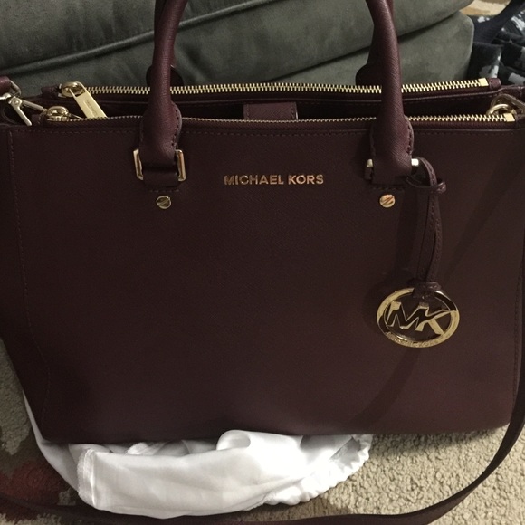 Trade w/ paulascloset14 Mk large merlot sutton
