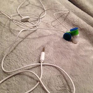 White headphones with peace sign ear piece