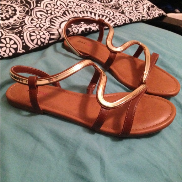 snake shaped gold sandals!