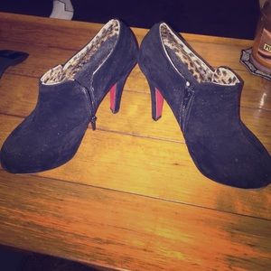Black suede booties with red bottoms