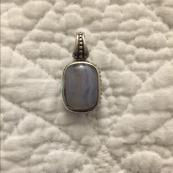 Two sided sterling silver pendant