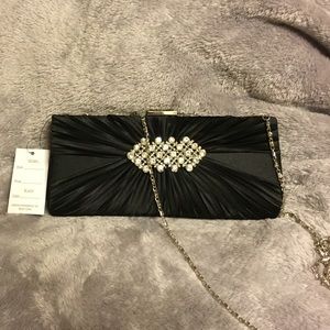 Black clutch with diamond pendant
