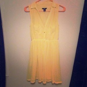 Yellow collared flows dress with pockets