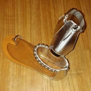 Flat sandal with ankle chain strap