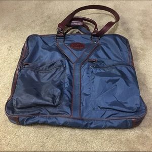 Yves Saint Laurent outfit travel bag