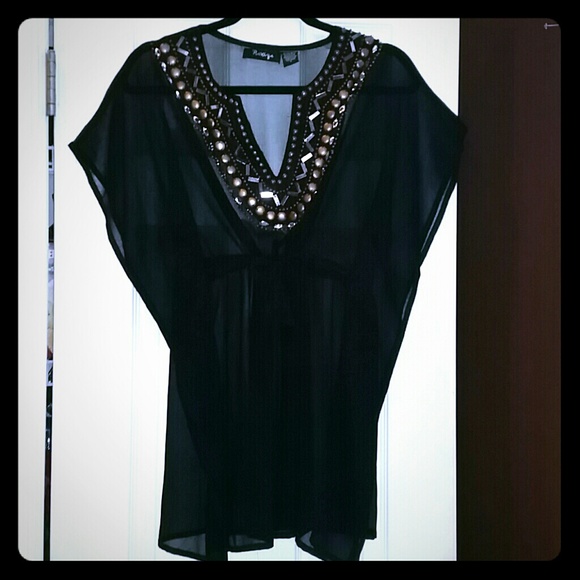 Wear over bathing suit. Or Layer over clothes