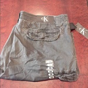 Men's size 38 cargo shorts with tags.