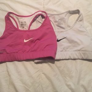 Two Nike dri-fit sports bras.