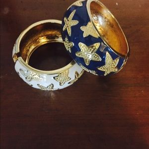 A blue bracelet and white bracelet