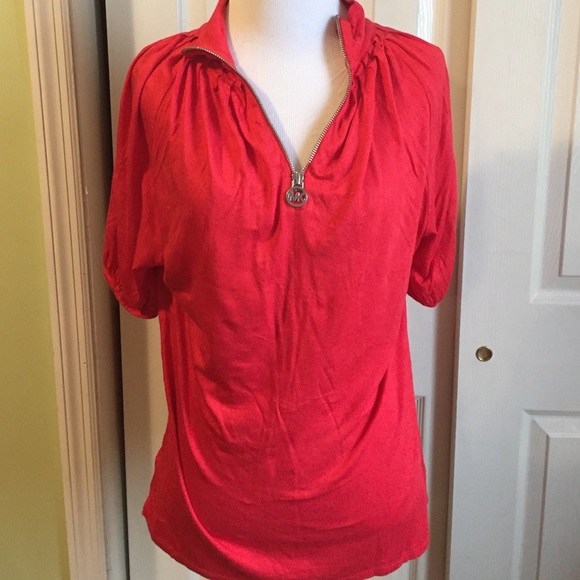 Red zipper up shirt.