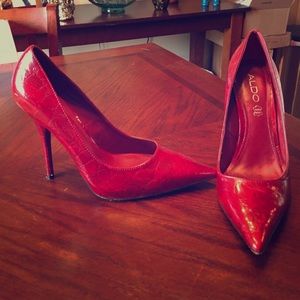 Red pointed toe pumps