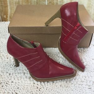 Red stiletto bootie w/ stack heel & stitch detail!