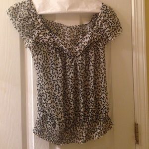An off white and black flower blouse
