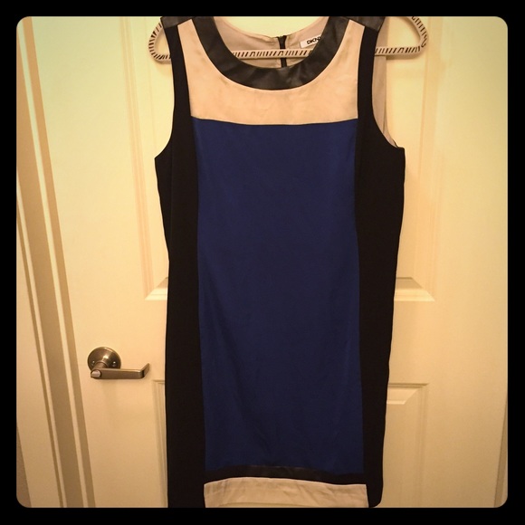 Sleeveless dress with faux leather accents