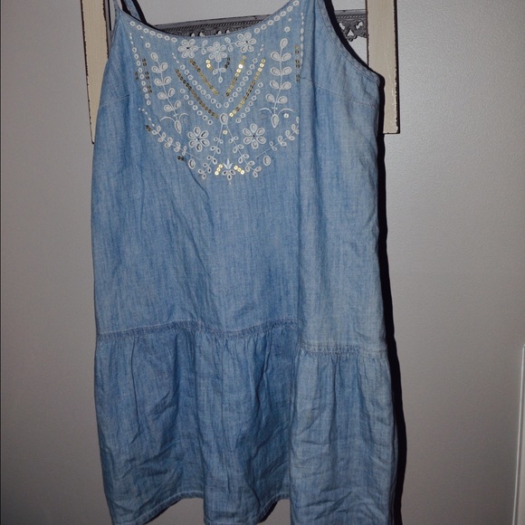 denim peplum tank with embellishments.