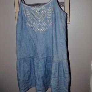 denim peplum tank with embellishments.