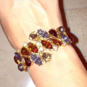Gold bracelet with multi colored rhinestones