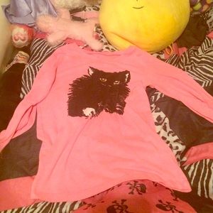 a cute pink shirt with a cat on it