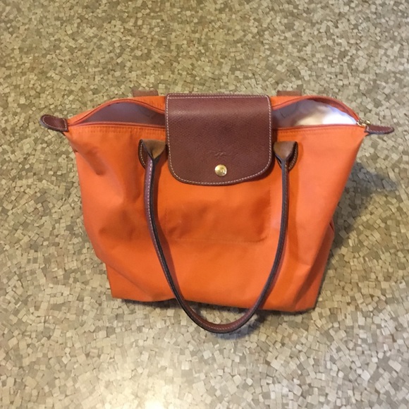 Longchamp Handbags - Longchamp orange purse used lots of life left !!