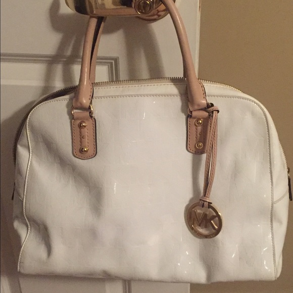 Michael Kors white purse less then a year old!