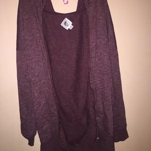 Maroon colored zip up jacket. Unisex