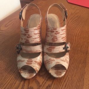 Brown and tan patent leather shoes.