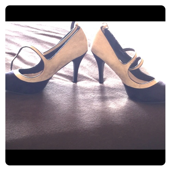 Tan and black high heeled shoes