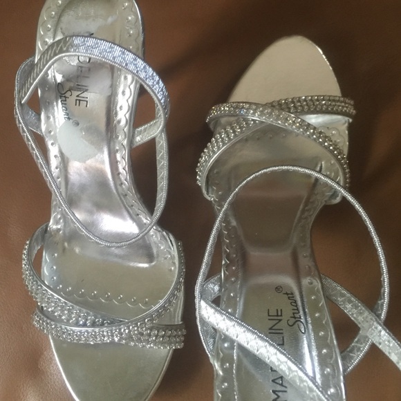 Sliver with jewels across the top.