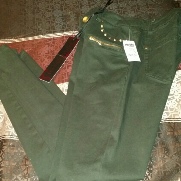 Olive green skinny jeans with gold spikes