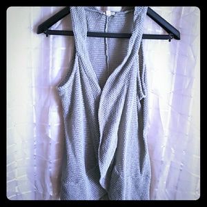 Gray sweater vest.