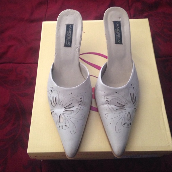 White heels with butterfly on front