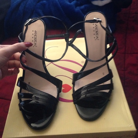 Shiny black strappy heels