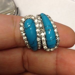 Silver tone ring with turquoise/clear stones
