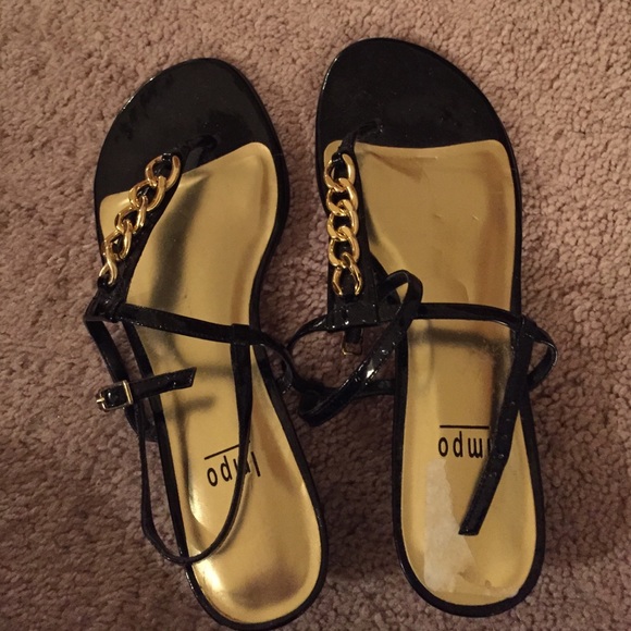 Size 8 M black sandals with gold hardware.