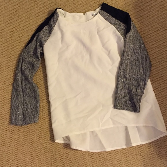 White shirt with gray and black sleeves