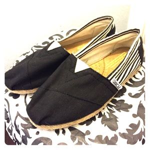 Black Toms with stripes on the sides.