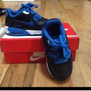 Kids Nike shoes and blue pants