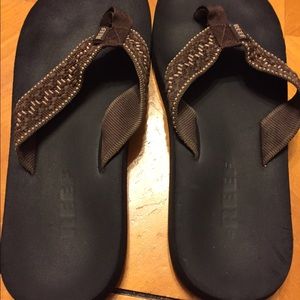 Brown flip flops